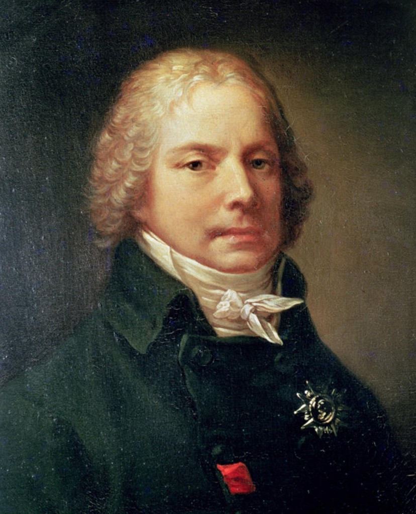 Ritratto a mezzo busto di Charles-Maurice de Talleyrand-Périgord, capelli incipriati mossi, mantello verde scuro dal collo alto, cravatta bianca annodata, grande placca a stella della Legion d'onore sul petto e rosetta rossa visibile; sfondo grigio-bruno — olio attribuito a François Gérard o alla sua bottega, Primo Impero francese
