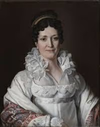 Half-length portrait of Elisa Bonaparte, Grand Duchess of Tuscany — white Empire gown with lace bodice, large white lace cherusque collar, richly patterned Kashmir shawl (red, blue, white), golden tiara, curled hair; dark neutral background — Neoclassical painting