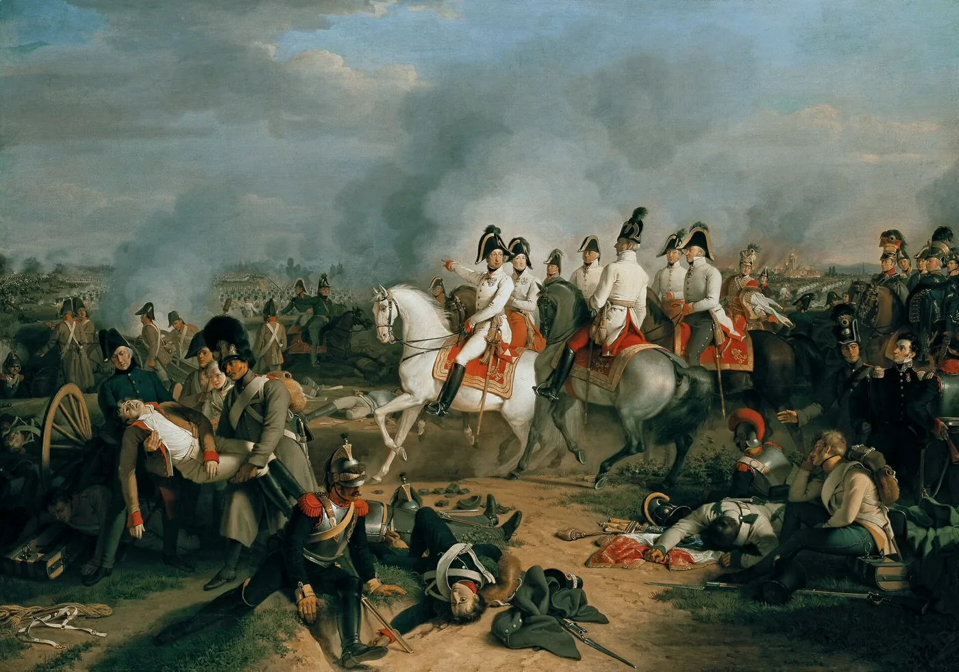 Erzherzog Karl in weißer Uniform auf einem Schimmel weist inmitten seines Stabes auf das Schlachtfeld; um ihn herum österreichische und französische Verwundete und Tote, darunter ein im Vordergrund sitzender Kürassier, in der Ferne ein brennendes Dorf
