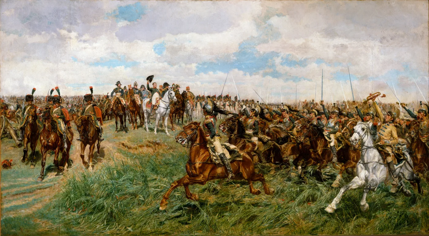 Napoleon on a white horse, surrounded by his staff, watches a mass of cuirassiers gallop past brandishing their sabres in a cornfield