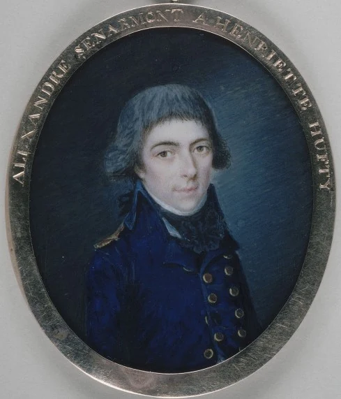 Oval miniature: portrait of a young officer with powdered hair in a blue coat with a high collar, in a frame bearing an inscription