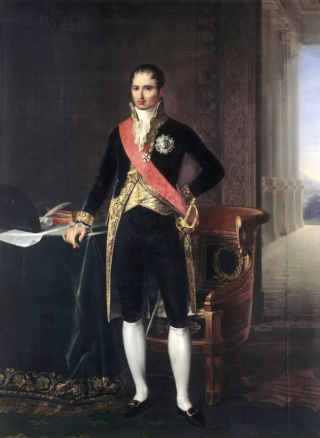 Portrait en pied de Joseph Bonaparte, roi de Naples puis roi d'Espagne (Joseph-Napoléon), frère aîné de Napoléon Ier — habit d'apparat du Premier Empire, velours brodé d'or, grand cordon, ordres et épée de cour ; intérieur néoclassique, fauteuil à couronne de laurier, colonnade — peinture officielle d'époque napoléonienne