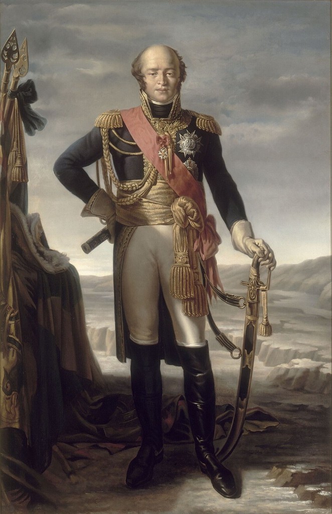 Portrait en pied de Louis-Nicolas Davout (1770-1823), maréchal d'Empire, duc d'Auerstedt et prince d'Eckmühl — grand uniforme bleu sombre brodé or, épaulettes, grand cordon rouge de la Légion d'honneur, décorations et sabre, gants blancs, culotte claire, bottes cavalières ; paysage rocailleux, trophées d'étendards au premier plan — Premier Empire, portraiture militaire néoclassique