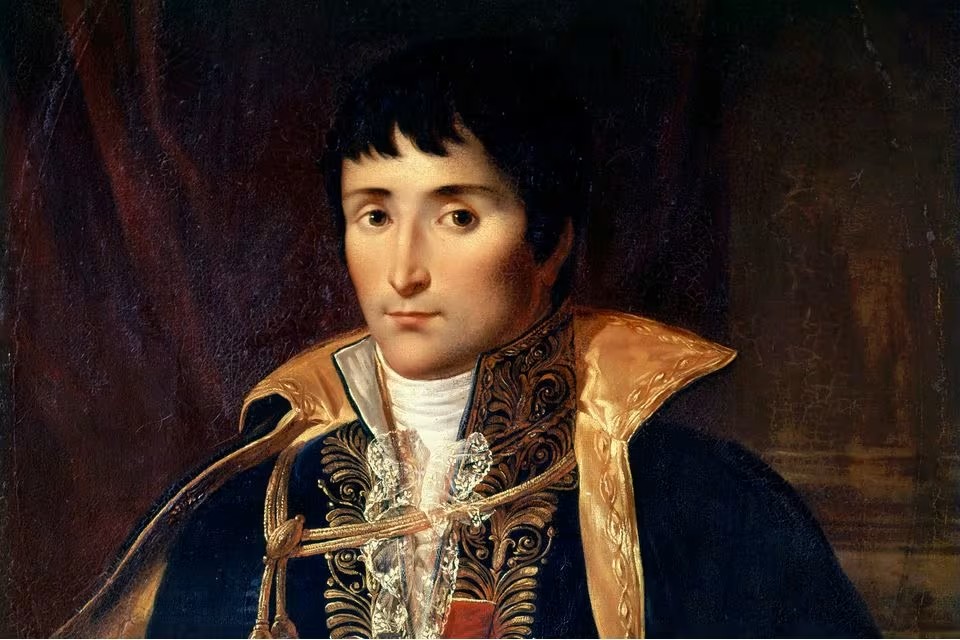 Portrait of Lucien Bonaparte (1775-1840), Prince of Canino, French statesman and brother of Napoleon I — half-length in official dark blue uniform with heavy gold embroidery, gold-trimmed high collar, white lace jabot and cravat, aiguillette, burgundy drapery at left, chiaroscuro on dark brown ground, Neoclassical oil painting of the First French Empire