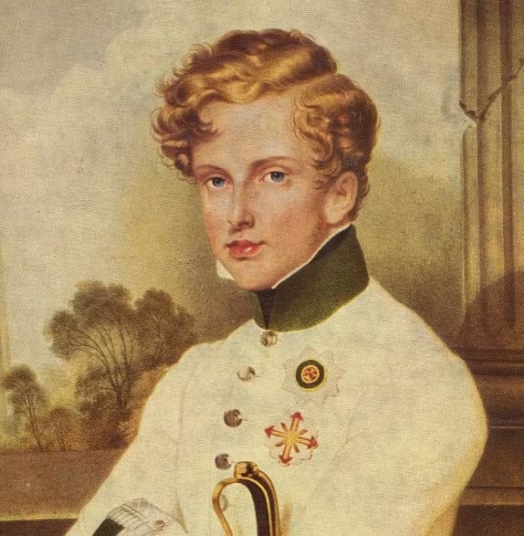 Portrait de Napoléon II, duc de Reichstadt et roi de Rome (l'Aiglon), en uniforme militaire blanc autrichien à col vert et décorations — buste, peinture à l'huile du début du XIXe siècle, colonne et paysage en arrière-plan