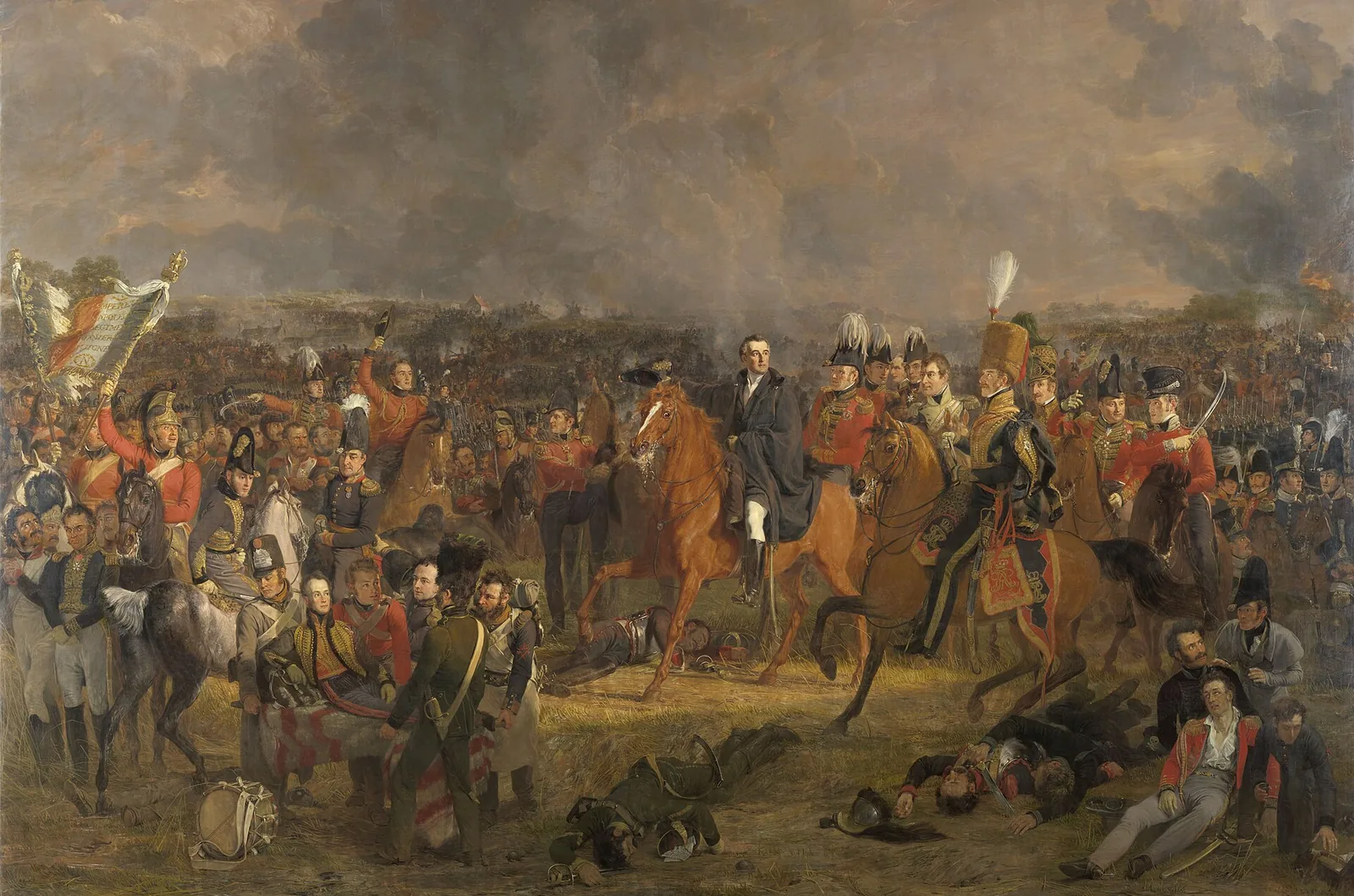 Wellington à cheval entouré de son état-major sur le champ de bataille, tandis qu'au premier plan à gauche le prince d'Orange blessé est emporté